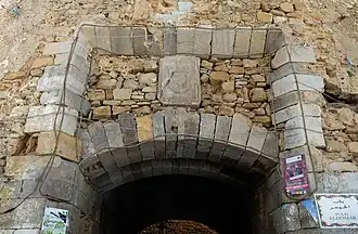 Portuguese coat of arms still visible above Bab Homar gateway