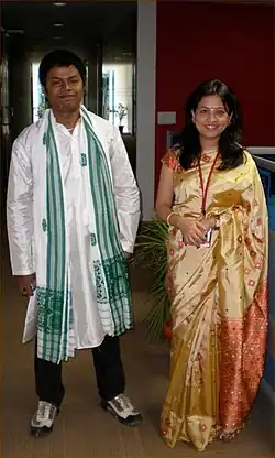 Image 122Indian couple wearing a mixture of traditional dress and Western clothing (from 2000s in fashion)