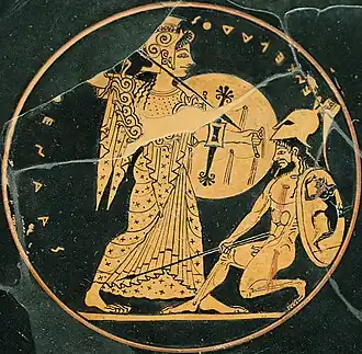 Athena, holding a spear and shield, slays a Giant