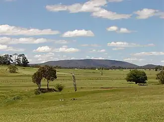 View of Mount Duval with farms in the foreground