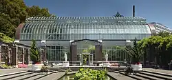 View of the Wintergardens Tropical House (1928) from the Temperate House (1921).