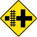 (W7-13) Railway Level Crossing on Crossroad (left)