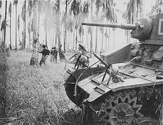Image 37Australian forces attack Japanese positions during the Battle of Buna–Gona, 7 January 1943. (from History of Papua New Guinea)