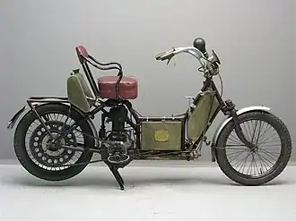 This was a step-through motorcycle with an armchair instead of a saddle