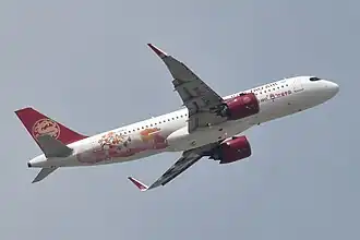 Juneyao Air Airbus A320neo, painted in a special Fuping Dried Persimmon livery in 2023