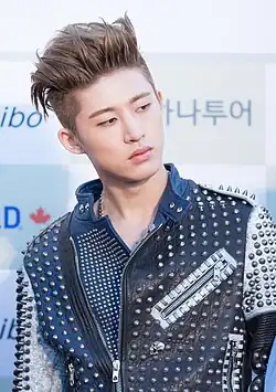 Image 70K-pop star B.I sporting an undercut hairstyle, 2016 (from 2010s in fashion)
