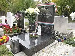 The grave (942/2-1-105) of Ferenc Badiny Jós at the Farkasrét Cemetery in Budapest, Hungary. Carven onto the tombstone is the symbol of the Hungarian Zuist Church.