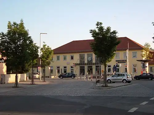 Wide two-story building with hip roof