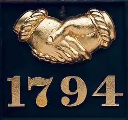 Gold leaf embellished Baltimore Equitable Society example. Unusually, the company still makes such fire marks and issues them to customers who want them.
