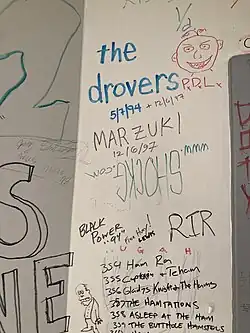 The Drovers signed the green room wall when they played Grinnell College's Harris Center