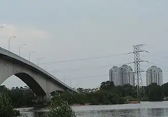 Permas Jaya Bridge, part of the Johor Bahru East Coast Parkway facing the direction of Permas Jaya across Tebrau River. At the background are blocks of the Straits View Condominium.
