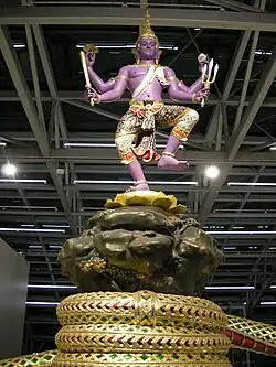 Statue of Narayana in Thai art style stands on Mount Mandara within Suvarnabhumi Airport, Samut Prakan, Thailand