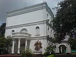 Broad semicircular carriage veranda with stairs in front of Burdwan House.