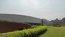 Green field and building