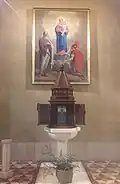 The baptismal font of Saint Bartholomew parish church in Marne, Italy