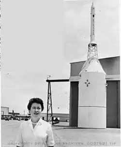 Barbara walks past Apollo spacecraft simulator en route to her office at North American Aviation in 1963, where she heads the department responsible for plotting the return course of the Apollo Moon rocket. Photo Courtesy: University of Illinois Archives at Urbana Champaign