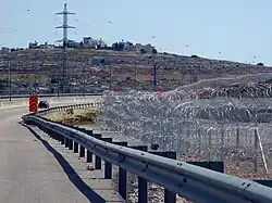 The barbed wire of the Israeli West Bank barrier (Giv'at Ze'ev, May 2010)