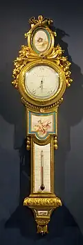 Louis XVI style barometer-thermometer; c. 1776; soft-paste Sèvres porcelain, enamel, and ormolu; height: 1 m, width: 0.27 m[125]