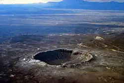 Image 35Meteor Crater in Arizona. Created 50,000 years ago by an impactor about 50 metres (160 ft) across, it shows that the accretion of the Solar System is not over. (from Formation and evolution of the Solar System)
