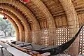 Outdoor compound: Reed guesthouse with traditional boat