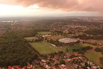 Aerial photograph of Bass Hill with Dunc Gray Velodrome and The Crest sporting precinct