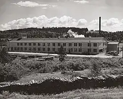 Black and white photograph of large industrial building