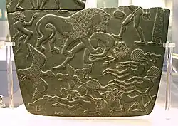 Image 36Possible prisoners and wounded men of the Buto-Maadi culture devoured by animals, while one is led by a man in long dress, probably an Egyptian official (fragment, top right corner). Battlefield Palette. (from Prehistoric Egypt)