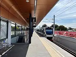 Elevated station platform with a train
