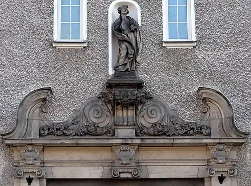 Statue of Saint John the Apostle above the portal