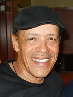 Headshot of Antunes in a dark environment