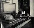 Chakkraphat Phiman Residential Hall: Royal couch of King Rama I, another umbrella hangs over this room