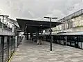 Picture of Bella Vista station. It consists of a platform with platform screen doors within a cutting below ground.