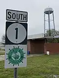 Benoit water tower in background, Mississippi Highway 1 sign in foreground.