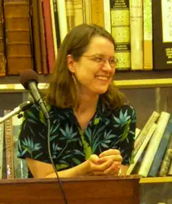 Leondar-Wright at a talk in Black Oak, AR