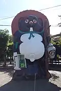 A phone booth shaped like a giant tanuki at Shigaraki Station.