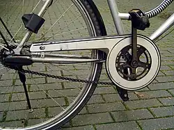 Partially enclosed chain case