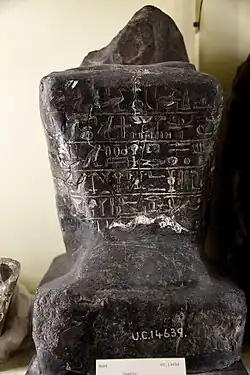 Black granite, seated statue of Sennefer with cartouche of Amenhotep&nbsp;II (Amenophis) on right arm. From the temple of Seth at Naqada, Egypt. The Petrie Museum of Egyptian Archaeology, London