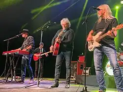 Country music band Blackhawk on a stage.