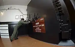 Missile crew member opens blast door
