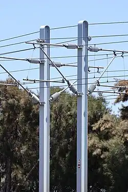 Steel overhead line equipment poles painted blue