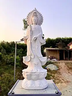 Stone statue of Quan Âm on the grounds of Phổ Lại Pagoda