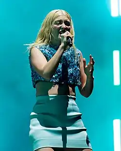 A person singing into a microphone