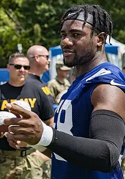 Black man in NFL uniform