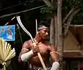 A Bokator practitioner carrying a phkak, a traditional Khmer axe.