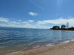 Beach "Tolkun" in Bosteri during sunny weather. June 2022.