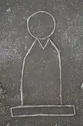 Bottle idol on a stele