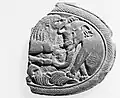 Box Lid with a Lion Attacking an Elephant, Gandhara, 5th century CE.[140]