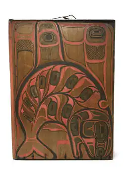 Painted wooden box drum (kóok gaaw) from the late 19th century, decorated with a stylized sea wolf (orca) design in black, red, and brown pigments.