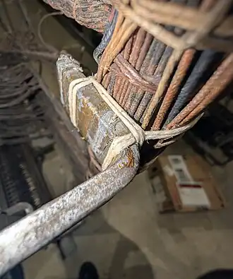 View of the box stitch showing how the cables are secured to the support.
