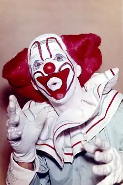 A picture of Bozo the Clown smiling.